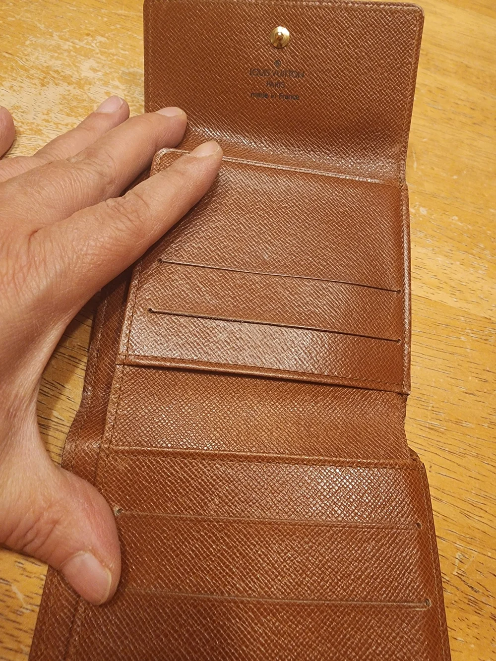 vintage Louis Vuitton Monogram Elise Wallet crafted in the classic brown LV